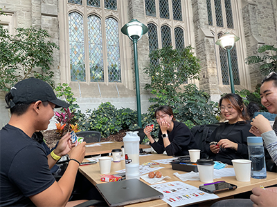 students playing uno and laughing